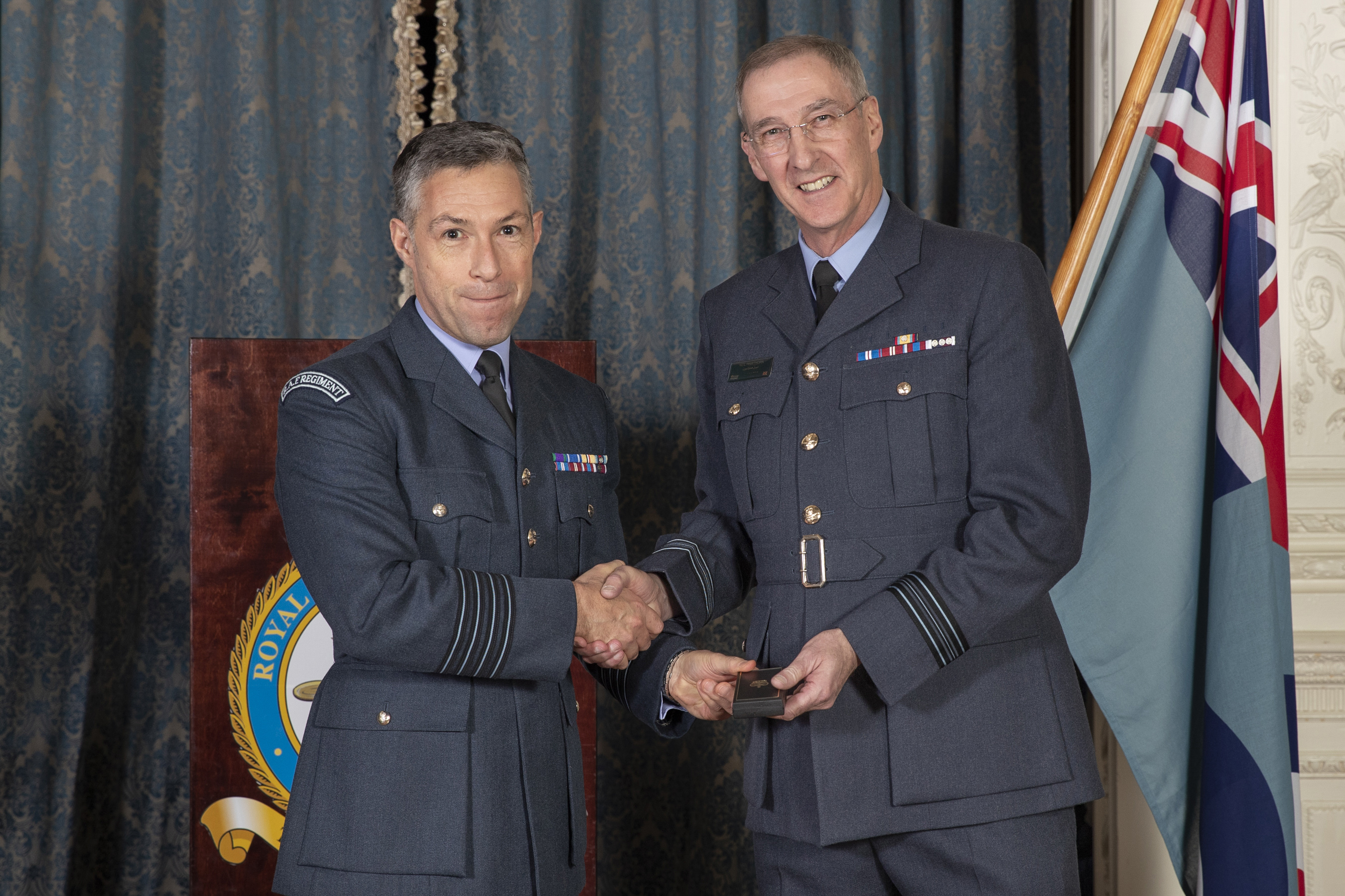 Image shows RAF Aviators shaking hands.
